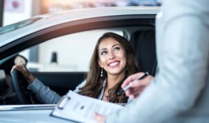 happy-customer-buying-brand-new-car-local-car-dealership-1
