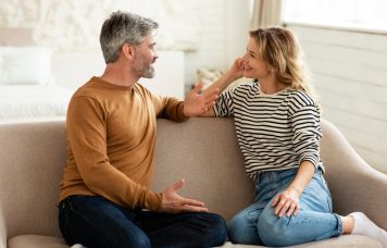 Cheerful,Middle,Aged,Couple,Talking,And,Flirting,Enjoying,Conversation,Spending